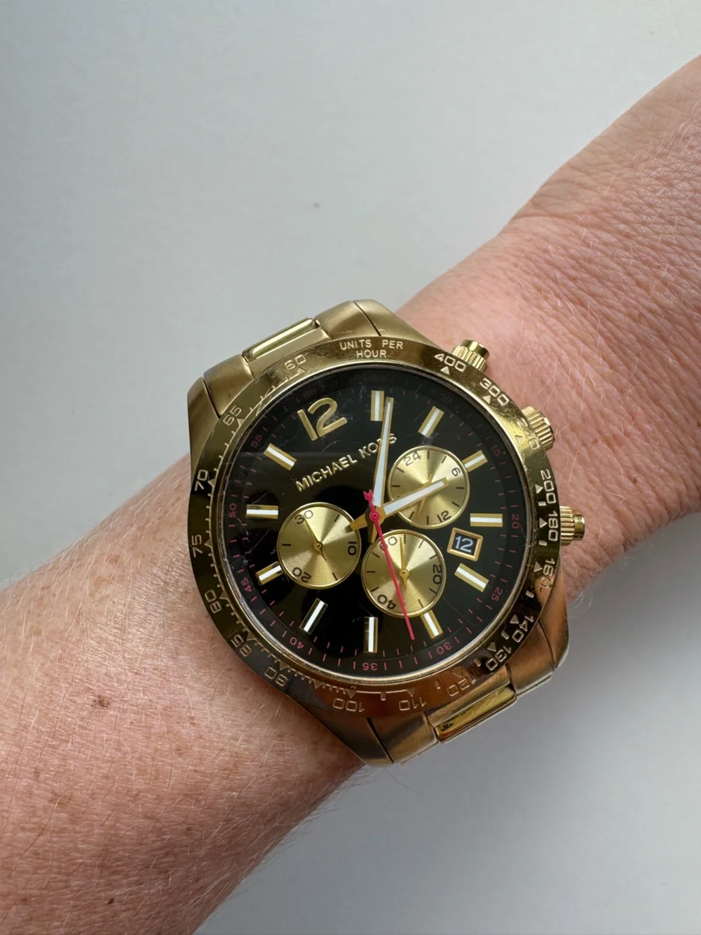 Michael Kors Gold and Black Chronograph Watch with Red Accent